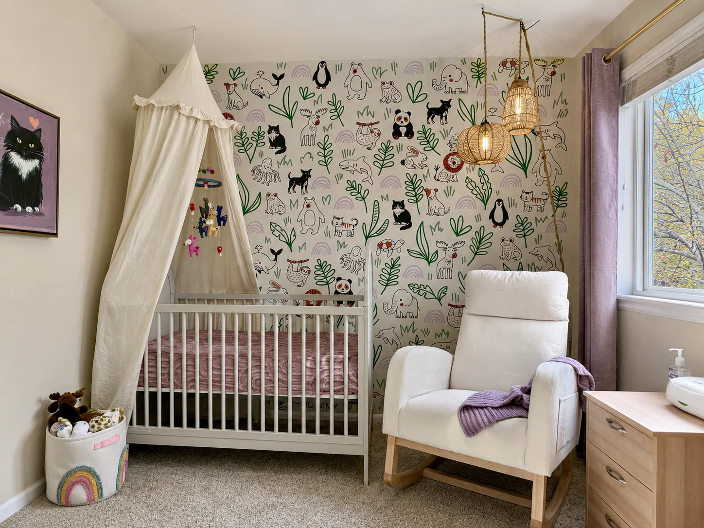Light-filled nursery with a hand-painted woodland animal mural wrapping the crib wall