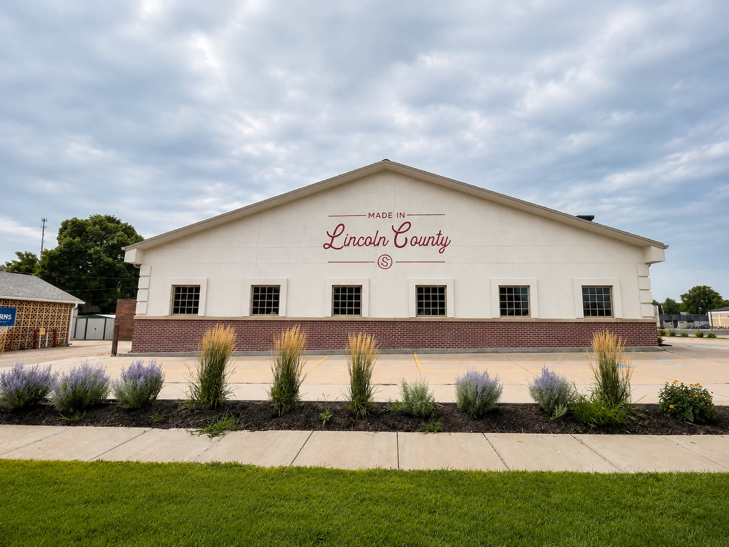 White Sandhills State Bank building with hand-painted red Lincoln County lettering across the facade