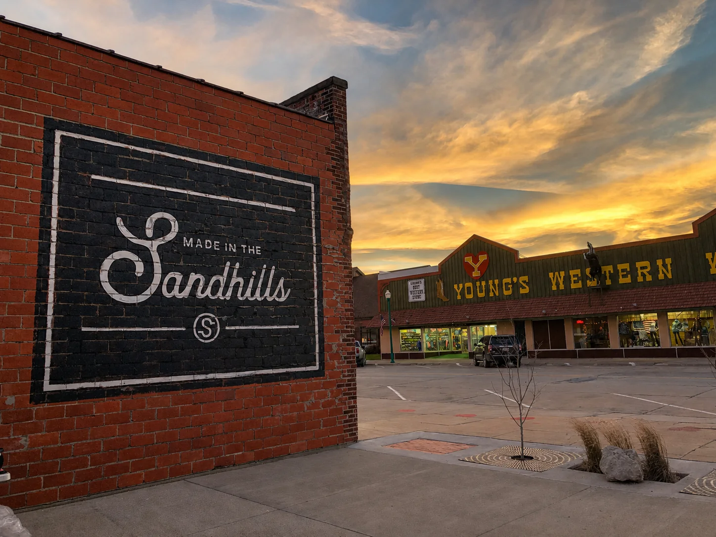 Made in the Sandhills mural on a brick wall overlooking downtown Valentine at sunset