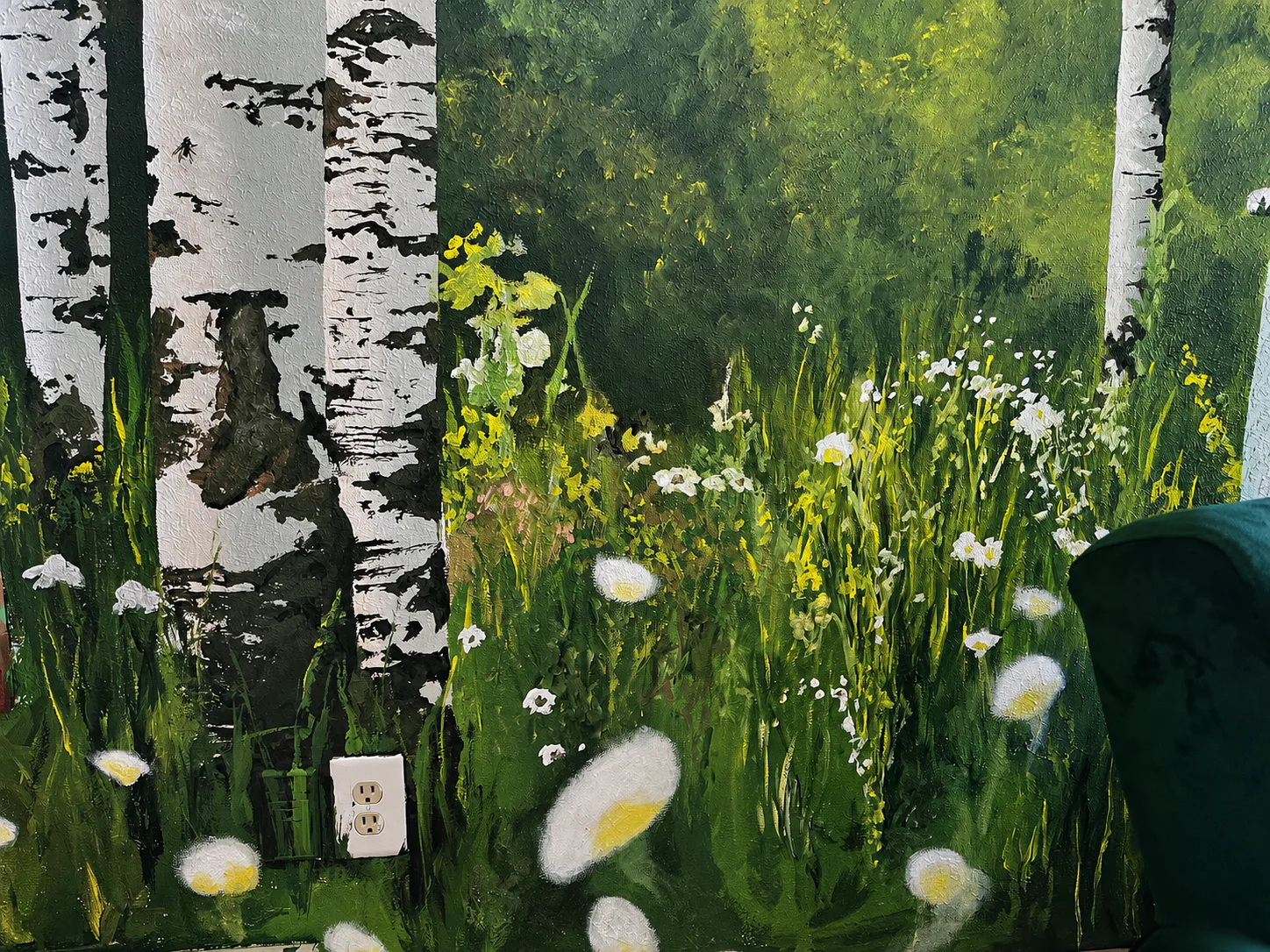 Painted birch trunks, wildflowers, grasses, and a sunlit field in The Scenic Route mural