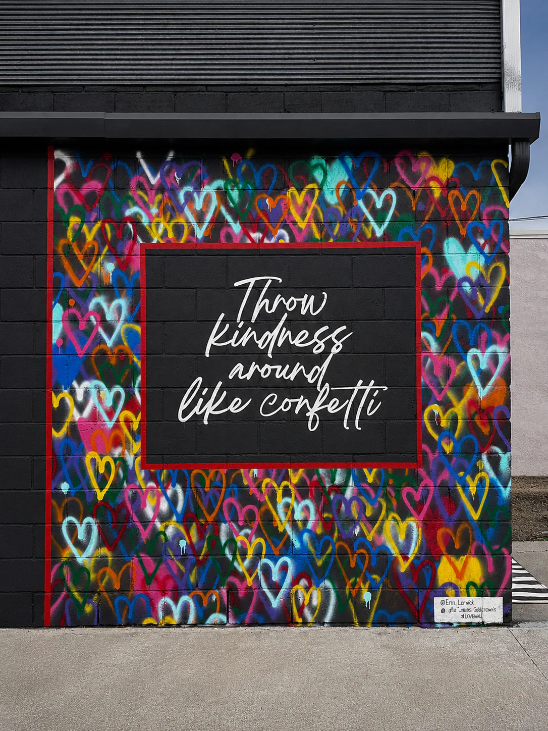 Colorful heart mural surrounding the hand-lettered message Throw kindness around like confetti