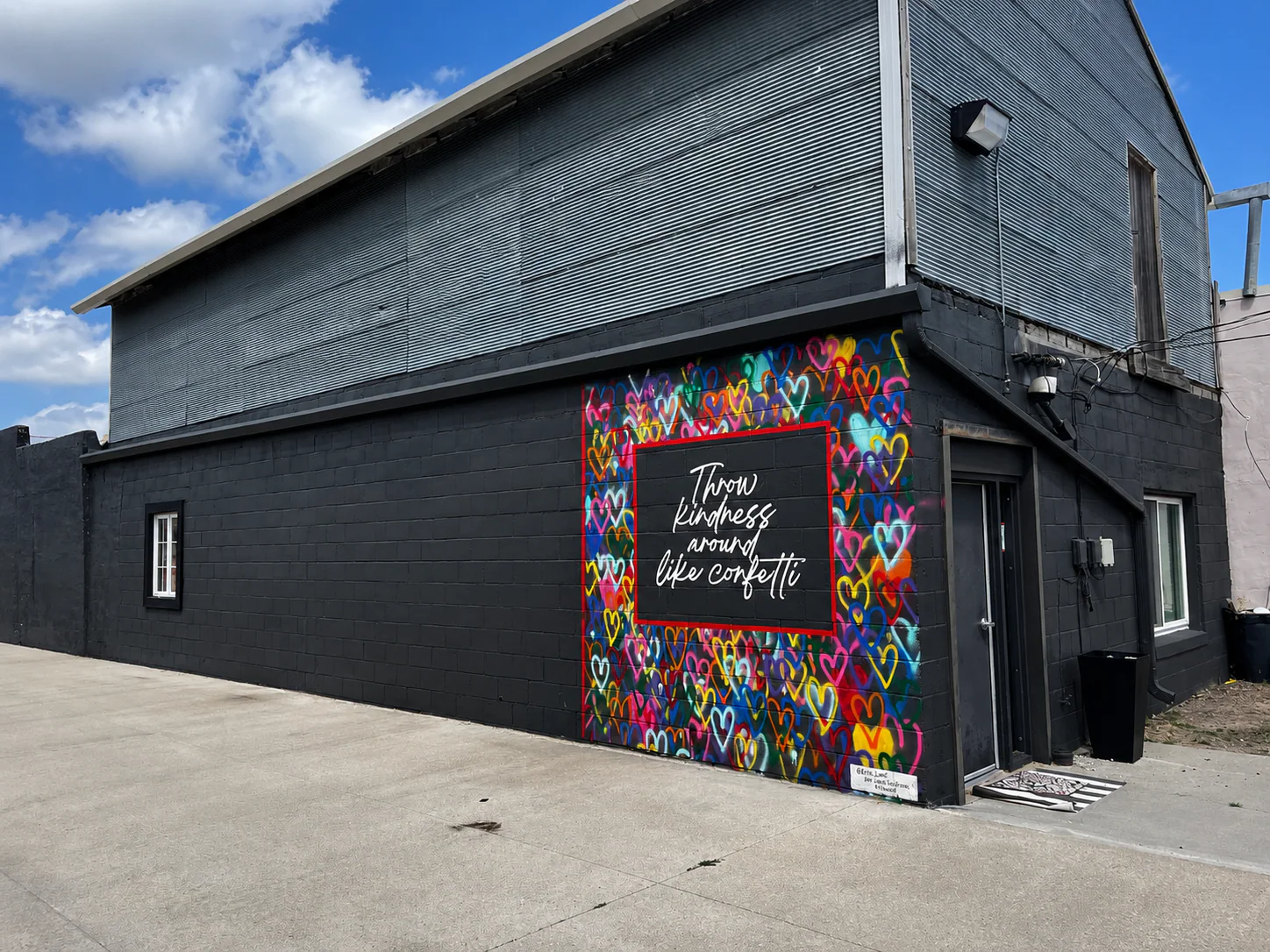 Black Valentine Dance Studio exterior with the colorful Throw Kindness mural facing the street